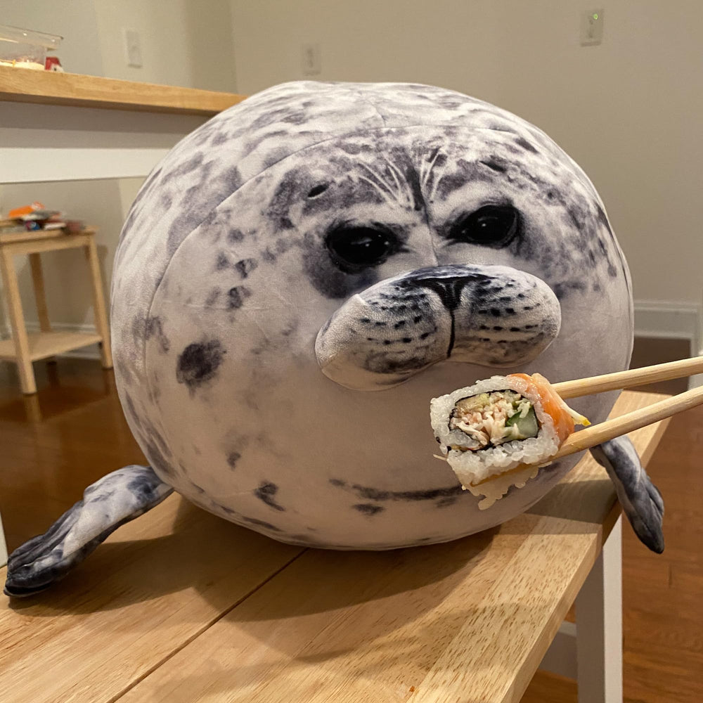 Pineapple Plush Seal Pillow side view showing soft fur and cuddly form
