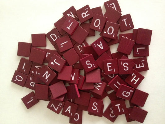 Planet Xpress maroon wood letter tiles for classic gameplay and decor.
