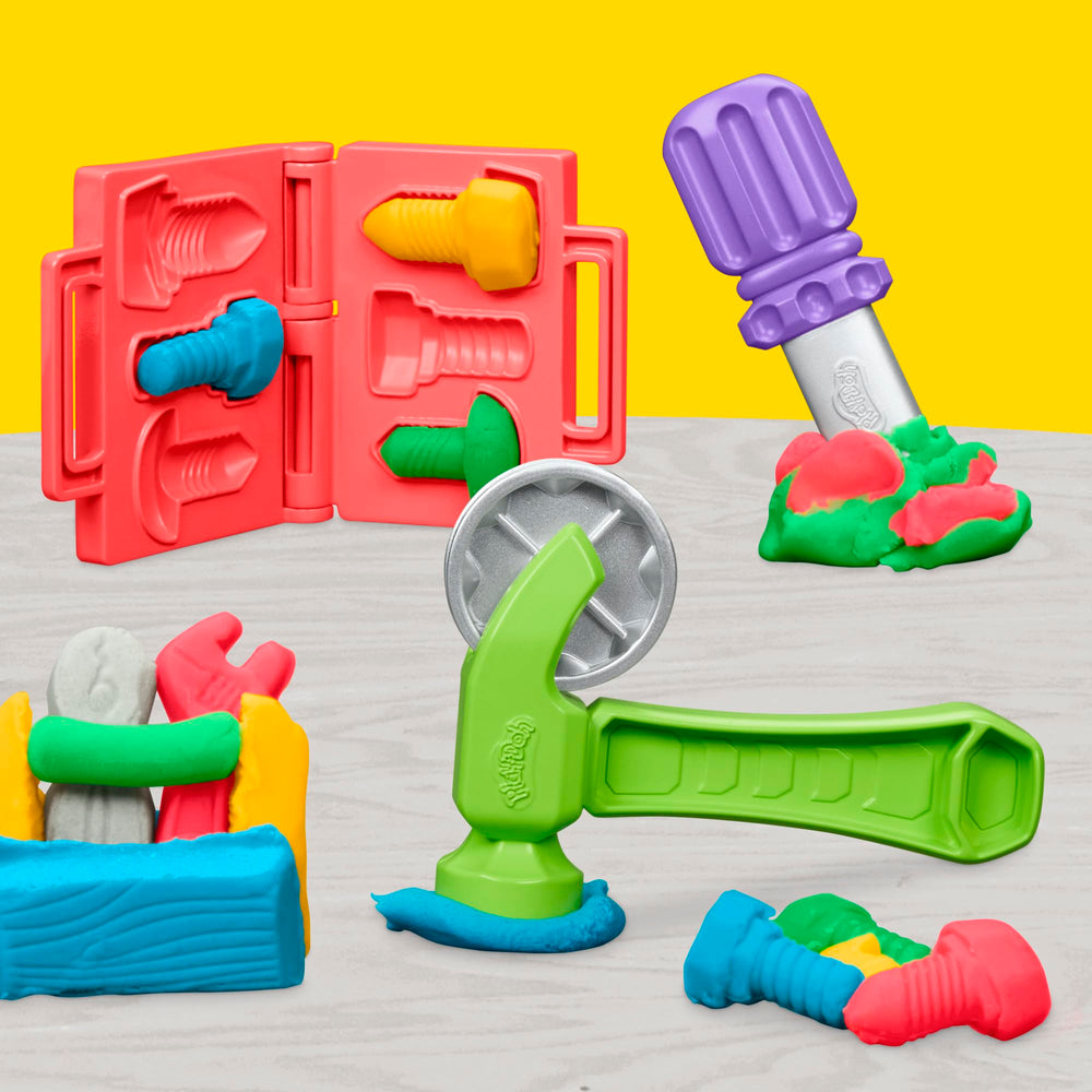 Play-Doh Stamp & Saw Tool Bench includes toy tools for pretend carpentry