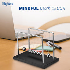 Playbees Newton's Cradle balances motion as a stylish living room accent.