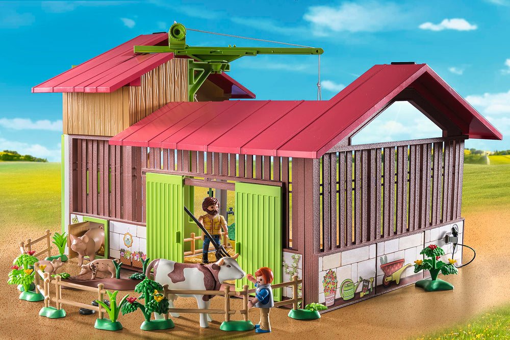 Playmobil Large Farm cows, pigs, dogs, and cats in a pen for interactive animal care.