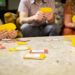 PlayMonster Relative Insanity card draw action during fast-paced rounds.