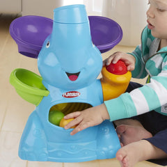 Playskool Elefun Busy Ball Popper balls flying into the room inviting chasing fun.
