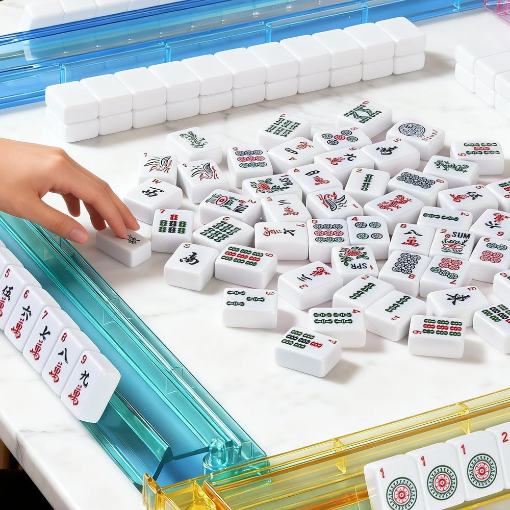 Ploomi family game night setup demonstrates portable, complete Western mahjong experience.