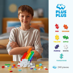 Close-up of PLUS PLUS rainbow bricks in vibrant colors for tactile building.