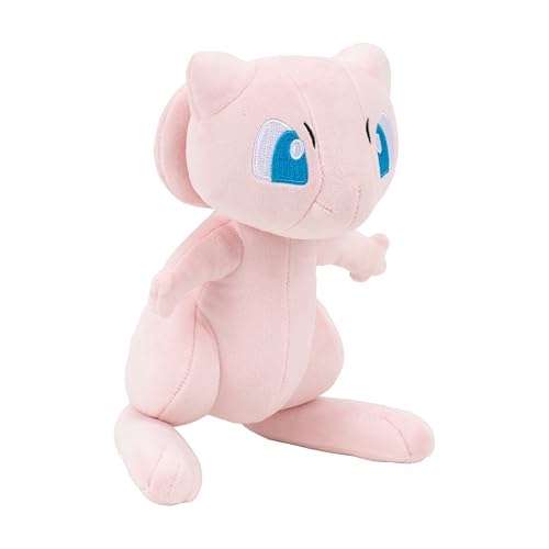 Pokémon Mew plush hand-size comparison shows portable companion on the go.