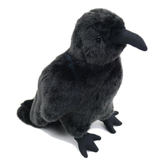 POPOTATO crow plush on a shelf in a cozy bedroom setting.