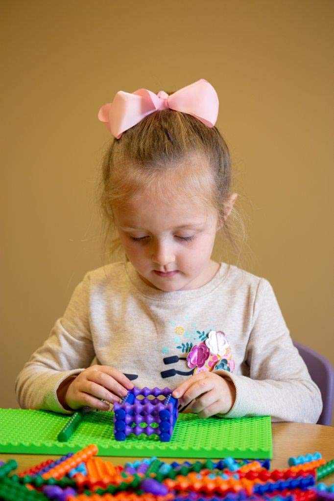 POPULAR PLAYTHINGS Playstix color-coded blocks for easy assembly and design exploration.
