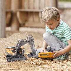 PREPOP excavator toy on sand demonstrating outdoor play