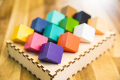 Project Genius Chroma Cube wooden tray with laser-cut edges for precise puzzle solving.