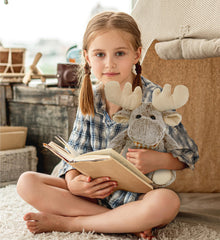 Puzzled brown moose plush invites gentle hugs at bedtime.