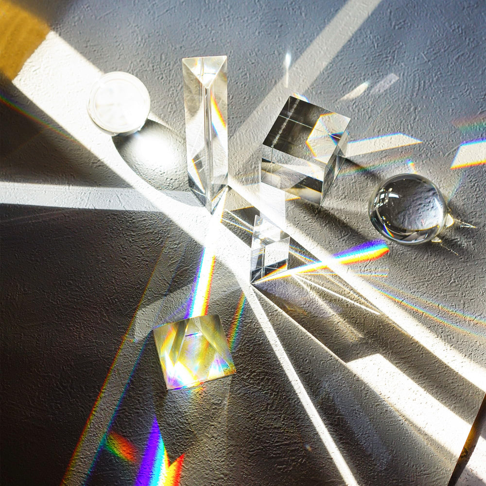 QFkris optical pyramid displaying geometric light patterns for compositions.