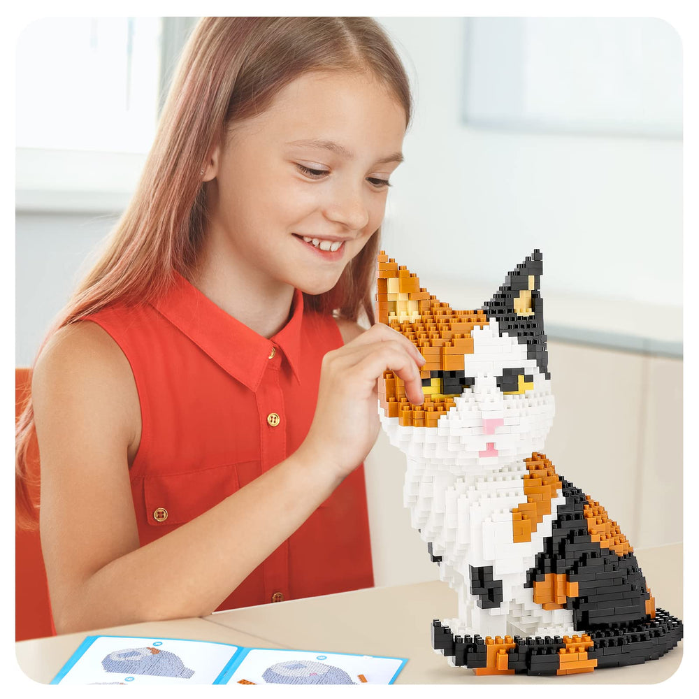 Display-closeup of QLT QIAOLETONG cat mini build blocks showing micro bricks texture.