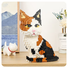Display-ready QLT QIAOLETONG cat mini build blocks on a shelf or desk.