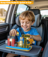 Kids enjoy on-the-go activity with portable magnetic blocks during car rides.