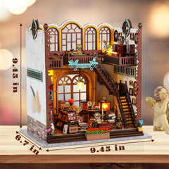 Quanquer magic book store dollhouse scene creates a warm reading corner.
