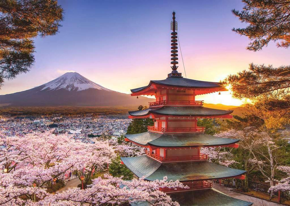 Ravensburger puzzle captures snow-capped Fuji against blossoms, ideal for travel lovers seeking serene downtime.