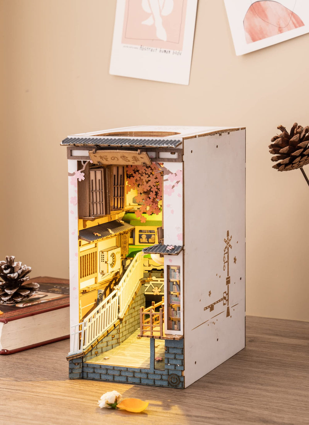 ROBOTIME Sakura Tram decorative bookend enhances bookshelf organization.