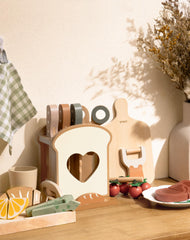 ROBUD wooden peeler and cutting board for safe pretend prep.