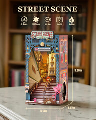 Rolife Book Nook cityscape night scene shows warm window light for cozy ambience.