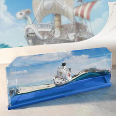 ROSSOM unsinkable Going Merry drift bottle on a desk, perfect desk decor and conversation starter.
