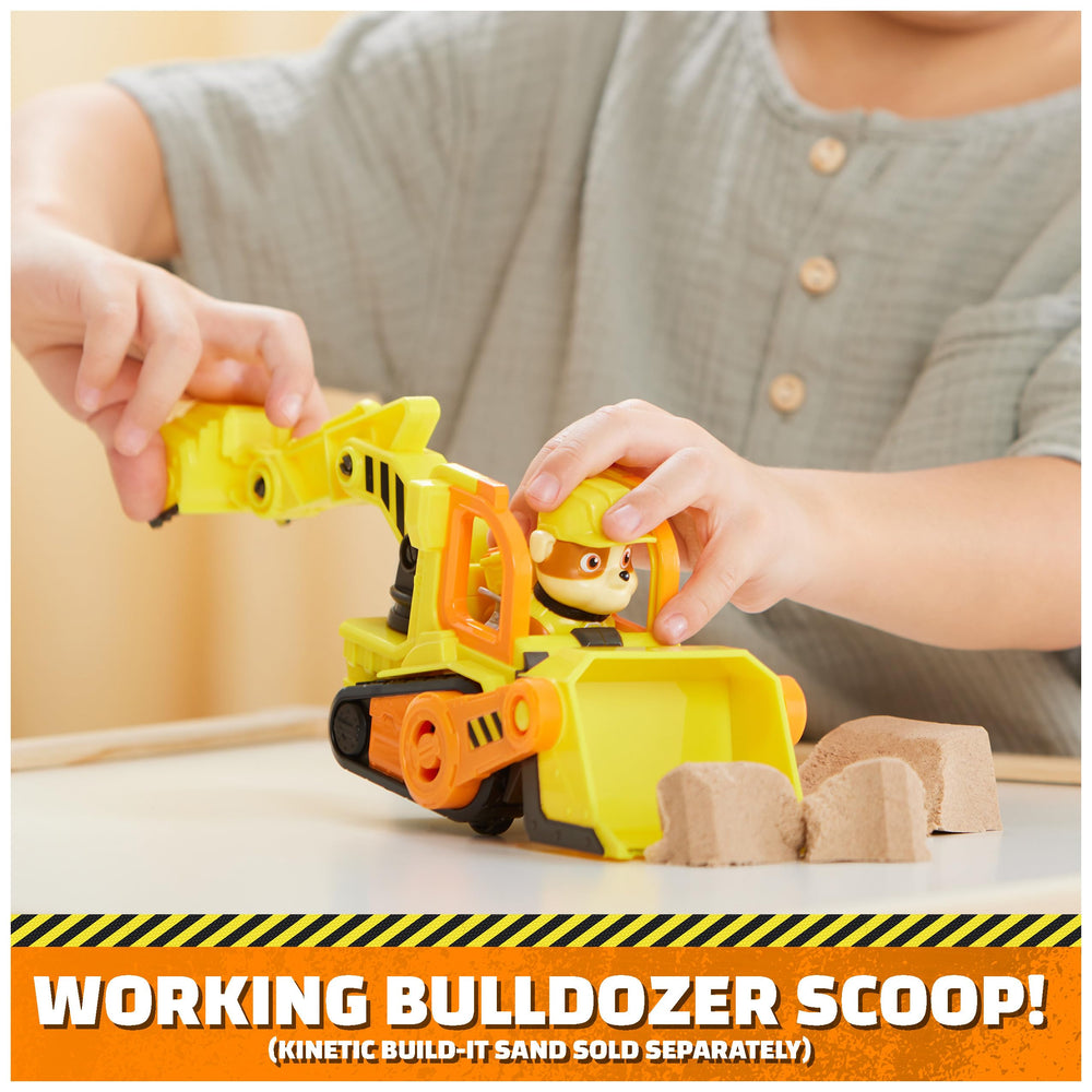 Rubble action figure seated in driver seat invites cooperative storytelling.