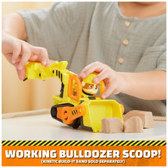 Rubble action figure seated in driver seat invites cooperative storytelling.