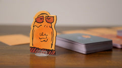 Runaway Parade Smug Owls card game supports up to 15 players for gatherings.