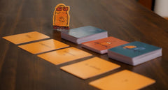 Runaway Parade Smug Owls card game offers endless riddles from a magic deck.