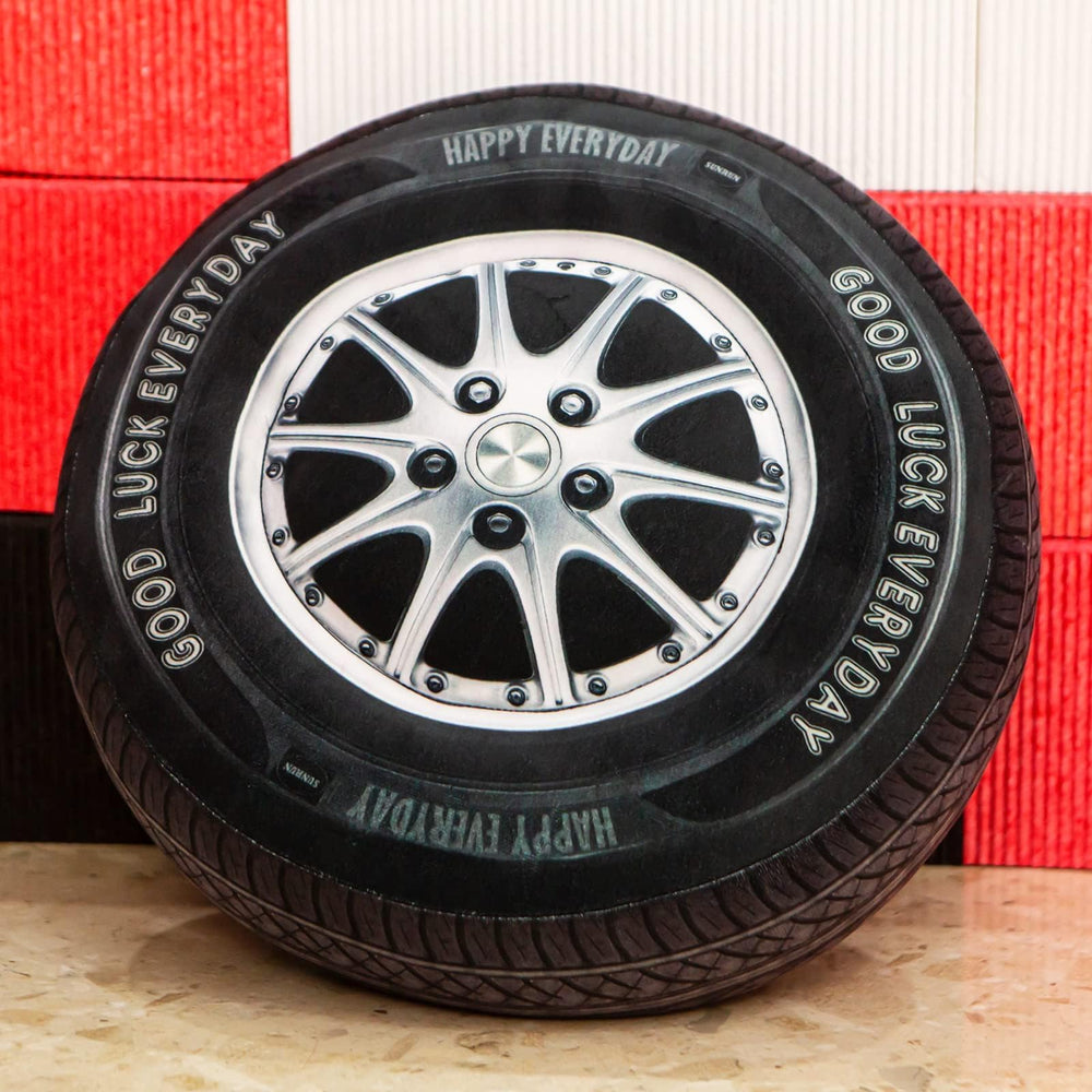 Ryttir 15.7in tire plush pillow offers cozy car wheel decor and stress-relief comfort.