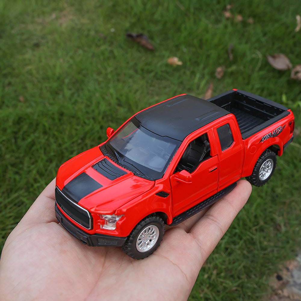 SASBSC F150 diecast red pickup truck on desk display.