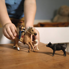 Schleich Farm World horse figure with western saddle for authentic riding play.