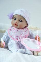 SCOM doll with vinyl head and limbs for durable realism during care play.