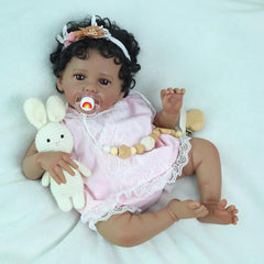 SCOM 20-inch soft-body doll with vinyl limbs provides flexible posing and cuddly handling.