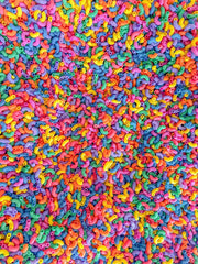 Sensory-N-Stuff color pasta provides a visually engaging focal point for activities.
