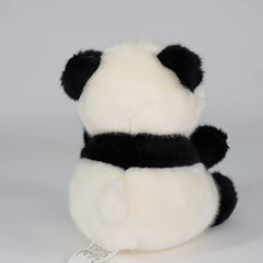 Sew Butiful panda plush on a nursery bed as decor