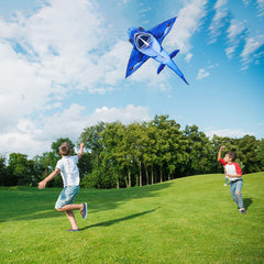 SGftre family enjoys outdoor kite flight in a park