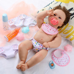 Shappy bib with floral print protects clothing during feeding play.