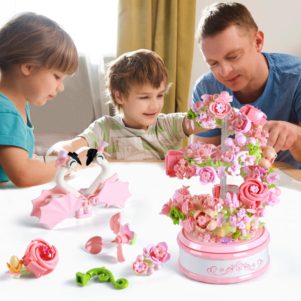 Two swans sit atop the flower bouquet in the SJIADA kit for a charming focal point.