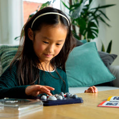SmartGames Asteroid Escape portable puzzle set invites family play