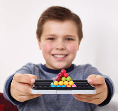 Family game night setup with SmartGames IQ Bundles for collaborative problem solving.
