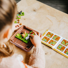 SmartGames Squirrels Go Nuts puzzle pieces invite careful problem solving.