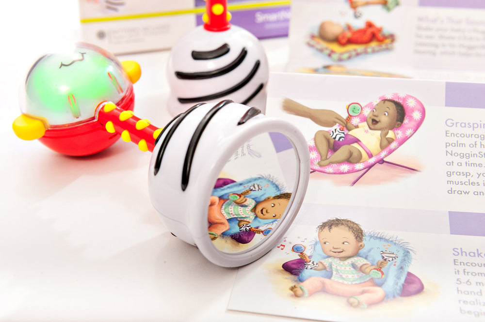 NogginStik easy-hold design promotes grasping and exploration.