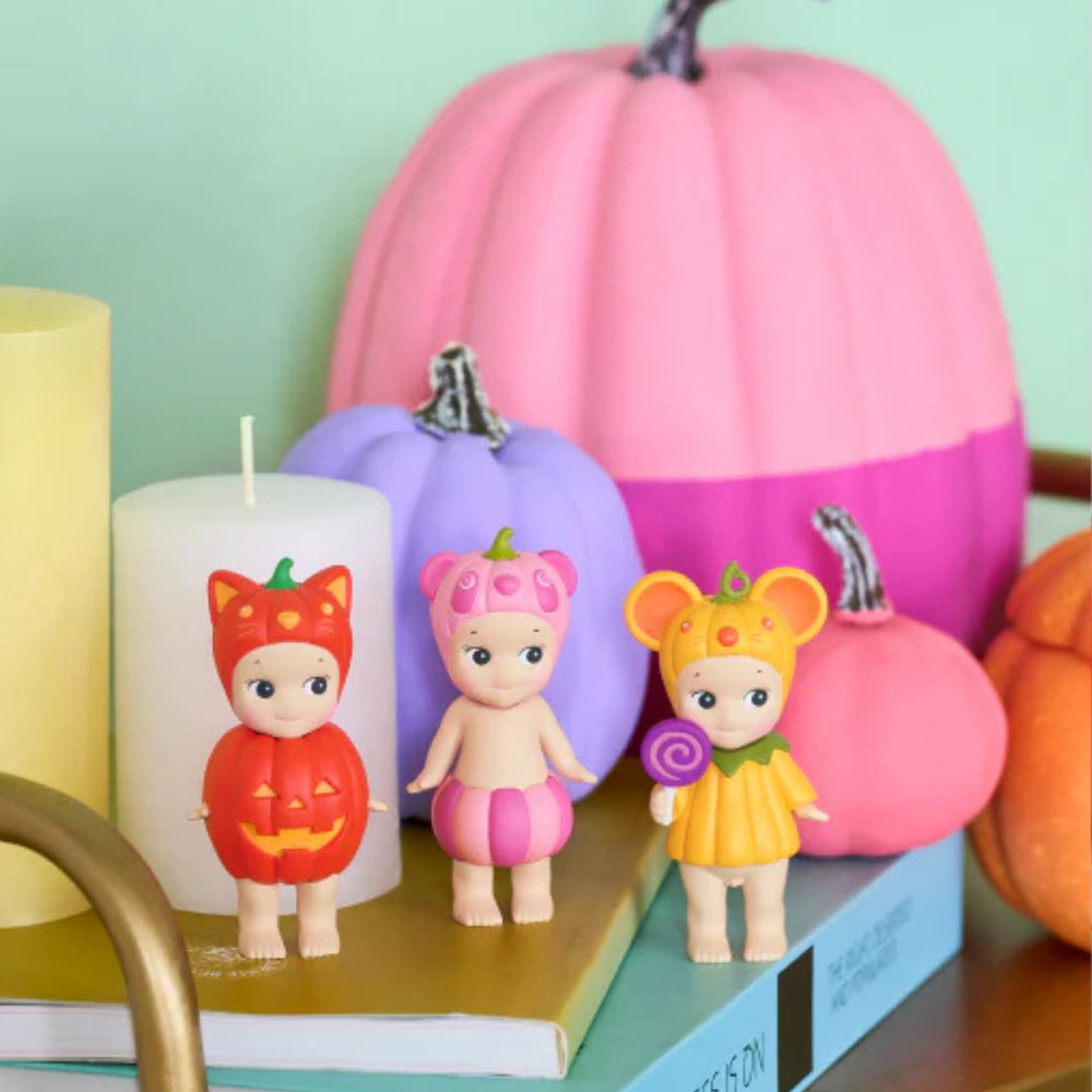 Sonny Angel Pumpkin Patch panda figure wearing a pumpkin hat for cute desk decor.