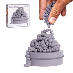 Speks Crags ferrite stones in a metal tin for mess-free tactile play