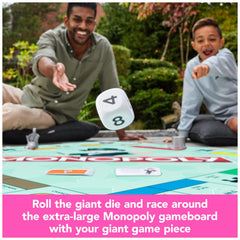 Spin Master Games Monopoly Giant Edition property cards and money meters track wealth.