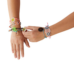 Spirograph Shrink Charms: beads and jump rings add wearable jewelry.