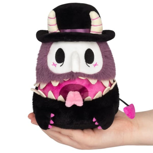Squishable Mimic Plague Doctor plush on desk for cozy snuggles.