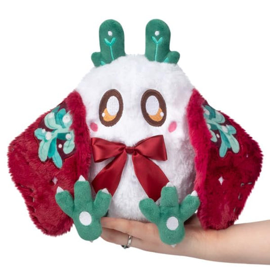 Squishable Mini Mistletoe Baby Mothman overhead kiss pose, cozy desk companion.