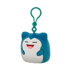 Squishmallows Snorlax clip hangs from car visor for a playful ride.